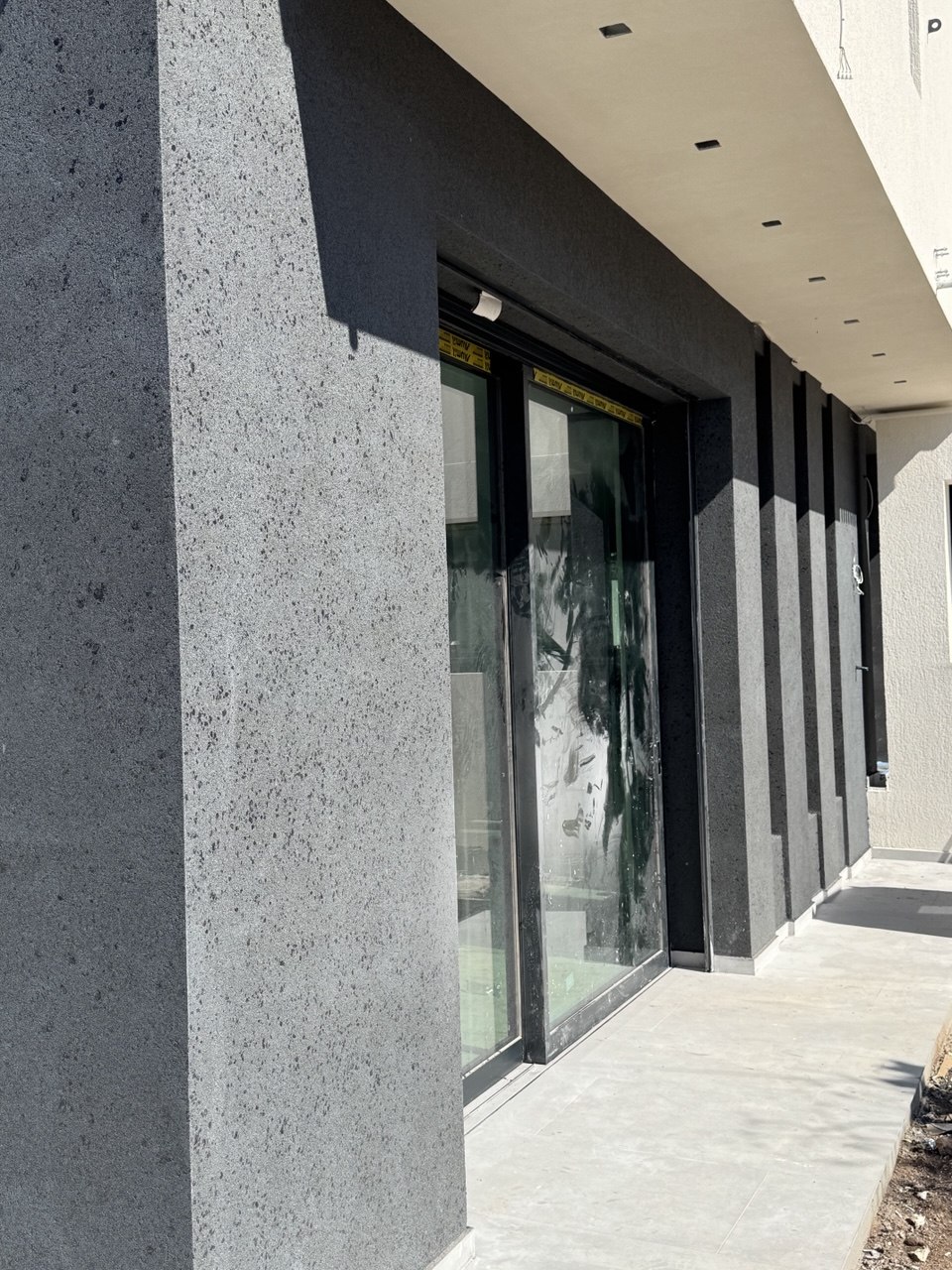 Grey decorative coating with natural stone effect